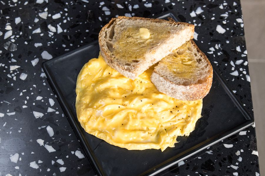 Creamy scrambled eggs on artisanal toast